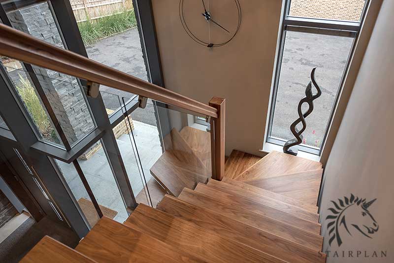 premium walnut stair treads with glass side panels